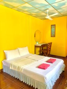 Postel nebo postele na pokoji v ubytování Koh Tao Tropicana Resort