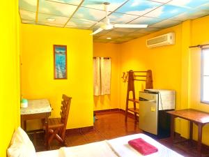 Postel nebo postele na pokoji v ubytování Koh Tao Tropicana Resort