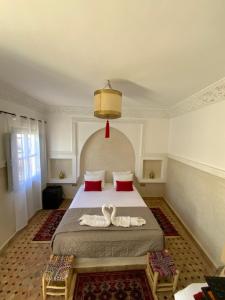 Postel nebo postele na pokoji v ubytování Riad magnolia privé