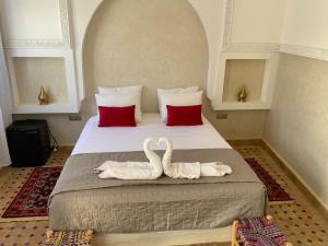 Postel nebo postele na pokoji v ubytování Riad magnolia privé