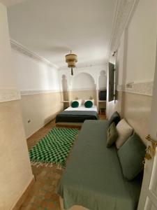 Postel nebo postele na pokoji v ubytování Riad magnolia privé