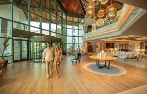 a man and a woman walking in a lobby at SH Villa Gadea in Altea +83 photos