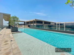 a swimming pool on top of a building at WelHome - Luxury Living in Dubai's City Walk Building 5 in Dubai