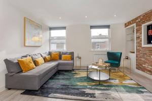 a living room with a couch and a table at York Luxury Apartments, Bishopthorpe Rd in York