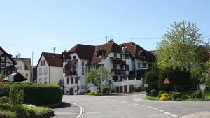 a street in a town with houses on a road at Hotel Adler in Lauda-Königshofen