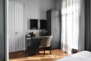 Postel nebo postele na pokoji v ubytování Allegro Neve Tzedek Boutique Suites - By HOMY