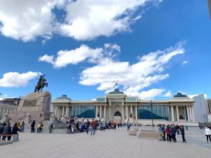 a large building with a statue in front of it at 135m2 new apartment 5 rooms with airport pickup in Ulaanbaatar