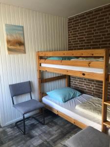 Katil dua tingkat atau katil-katil dua tingkat dalam bilik di Meno Mosso