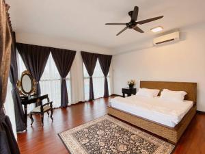 a bedroom with a bed and a ceiling fan at B03 Create SweetExperience In Larkin in Johor Bahru