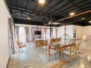 a living room with a dining room table and chairs at B03 Create SweetExperience In Larkin in Johor Bahru