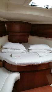 two beds in the back of a boat at Sail boat ANIMATO in Izola