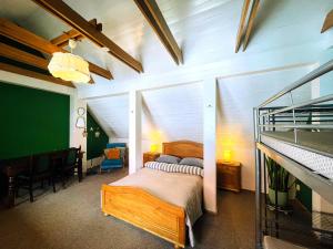 a bedroom with a bunk bed in a room at Mikalo House in Vilnius