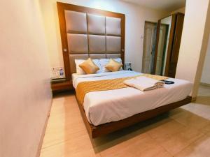 Postel nebo postele na pokoji v ubytování Apex Hotel