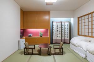 Voodi või voodid majutusasutuse 札幌西野夢幻夜景附庭院 Sapporo Night View House toas