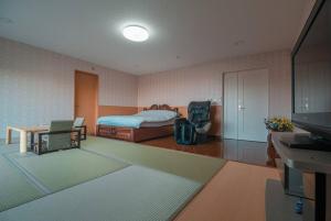 Voodi või voodid majutusasutuse 札幌西野夢幻夜景附庭院 Sapporo Night View House toas