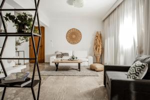 a living room with a couch and a table at Diov Bohali House in Zakynthos Town