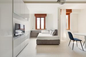 Łóżko lub łóżka w pokoju w obiekcie Milano Renovated Studio APTS