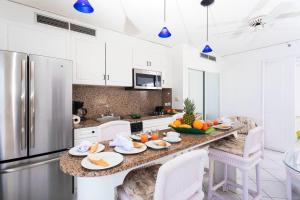 a kitchen with a table with fruit on it at Modern studio with swimming pool in Lowlands - 68 m² in Lowlands