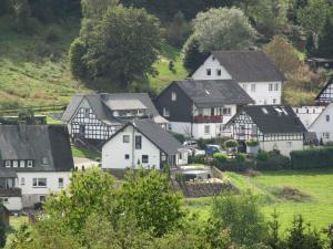 a group of white houses in a village at Ferienwohnung Christel in Schmallenberg