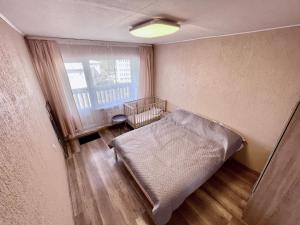 Postel nebo postele na pokoji v ubytování Luks