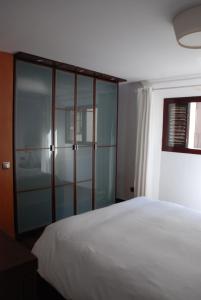 Cama o camas de una habitación en La Casa de la Alameda