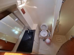 an overhead view of a bathroom with a toilet and shower at Sail boat ANIMATO in Izola