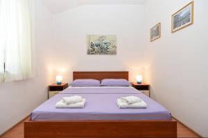 Postel nebo postele na pokoji v ubytování Apartments Mira 1293