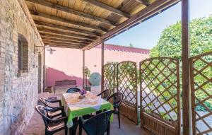 a patio with a table and chairs on a balcony at Country House Il Vecchio Frantoio in Monteleone dʼOrvieto