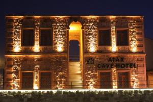 a building with lights on the side of it at Atax Cave House in Avanos