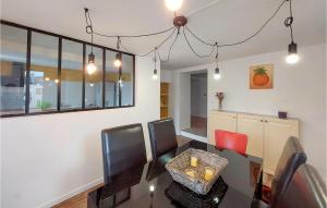 a dining room with a table and chairs at Cozy Home In Pexonne With Wifi in Pexonne