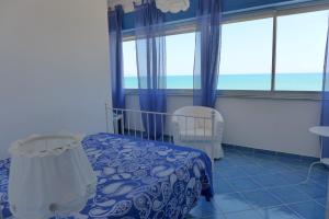 Postel nebo postele na pokoji v ubytování B&B Mammaliturchi SCALA DEI TURCHI
