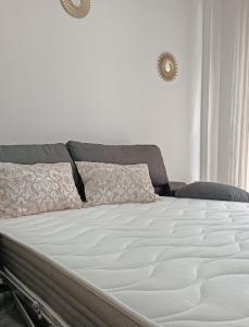a close up of a large bed in a bedroom at Mar Menor in San Pedro del Pinatar