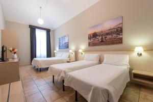 Postel nebo postele na pokoji v ubytování Best Quality Hotel Dock Milano