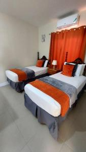 Letto o letti in una camera di Hamilton @ Oceanpointe a serene 2bed 2 bath Villa