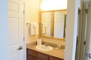 a bathroom with a sink and a mirror at Staybridge Suites Houston West - Energy Corridor, an IHG Hotel in Houston