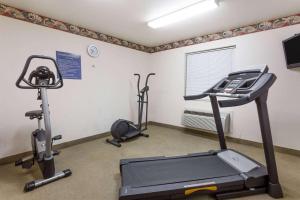 a gym with two exercise bikes and a treadmill at Days Inn by Wyndham Fordyce in Fordyce