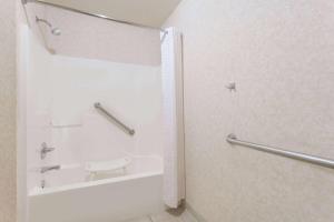 a bathroom with a shower and a toilet at Days Inn by Wyndham Fordyce in Fordyce