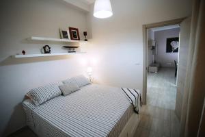 Ένα ή περισσότερα κρεβάτια σε δωμάτιο στο Il Moretto