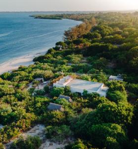 an aerial view of a house on a beach at The Slow Leopard Kilwa in Kilwa Masoko