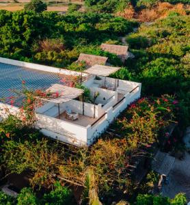an aerial view of a house with a roof at The Slow Leopard Kilwa in Kilwa Masoko