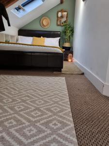 a bedroom with a bed and a carpet at Safire home in Murton