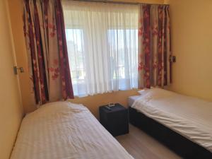 Postel nebo postele na pokoji v ubytování Hotel Aux Beaux Rivages En Gaume