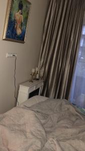 Кровать или кровати в номере Piliamesčio apartamentai