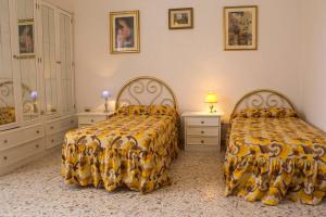 La casa di Nonno Ciccito tesisinde bir odada yatak veya yataklar