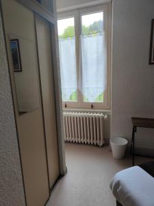 Postel nebo postele na pokoji v ubytování Hotel Au Val Doré