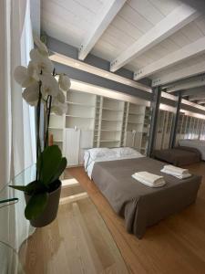 A bed or beds in a room at Casa Giulietta - ombrellone e 2 lettini inclusi