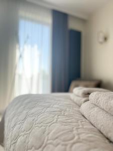 Posteľ alebo postele v izbe v ubytovaní BUNASTA Apartments