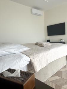 Posteľ alebo postele v izbe v ubytovaní BUNASTA Apartments
