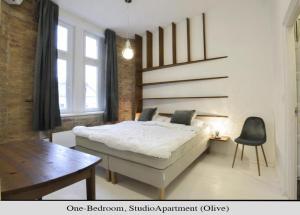 Posteľ alebo postele v izbe v ubytovaní Golden Leaf Apartment