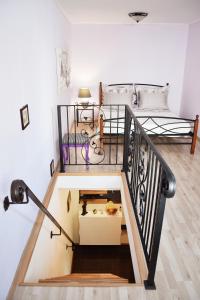 a room with a staircase leading to a bedroom with a bed at Lavender cozy & lovely 17 in Split